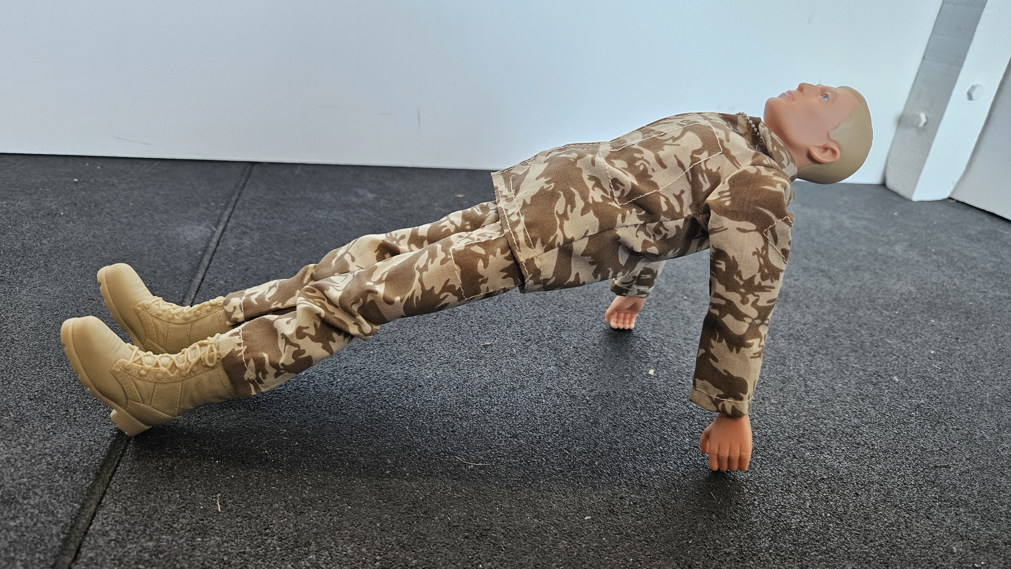 Action Man doing Upward Plank Pose